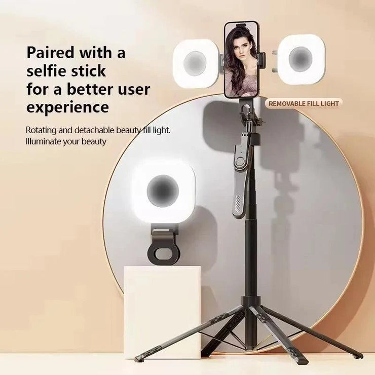 Mini LED smartphone selfie fill light with adjustable brightness clipped on a selfie stick tripod for video and TikTok live streaming.