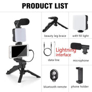 Smartphone vlogging kit with tripod, mini microphone, LED fill light, phone holder, Bluetooth remote, and audio cables for TikTok and YouTube videos.