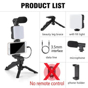 Smartphone vlogging kit with tripod, mini microphone, LED fill light, phone holder, and 3.5mm data cable for live streaming and video creation.