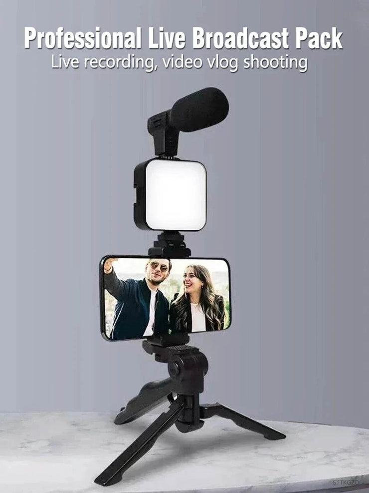 Smartphone vlogging kit with tripod, phone holder, LED fill light, and mini microphone for live streaming and video recording