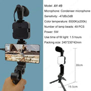 Smartphone vlogging kit with tripod, condenser microphone, LED fill light, and mobile phone holder for live streaming and video recording.