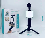 Smartphone vlogging kit with tripod, LED fill light, and mini microphone for live streaming and video making.