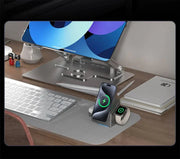 Grey multifunctional smartwatch charger with magnetic wireless charging and Type-C connector displayed on a desk charging a phone and smartwatch.