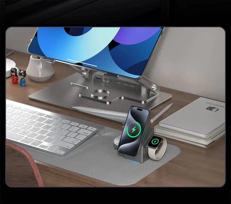 Grey multifunctional smartwatch charger with magnetic wireless charging and Type-C connector displayed on a desk charging a phone and smartwatch.