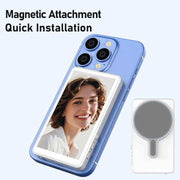 Content creator using a magnetic selfie screen with smartphone on tripod during outdoor shoot